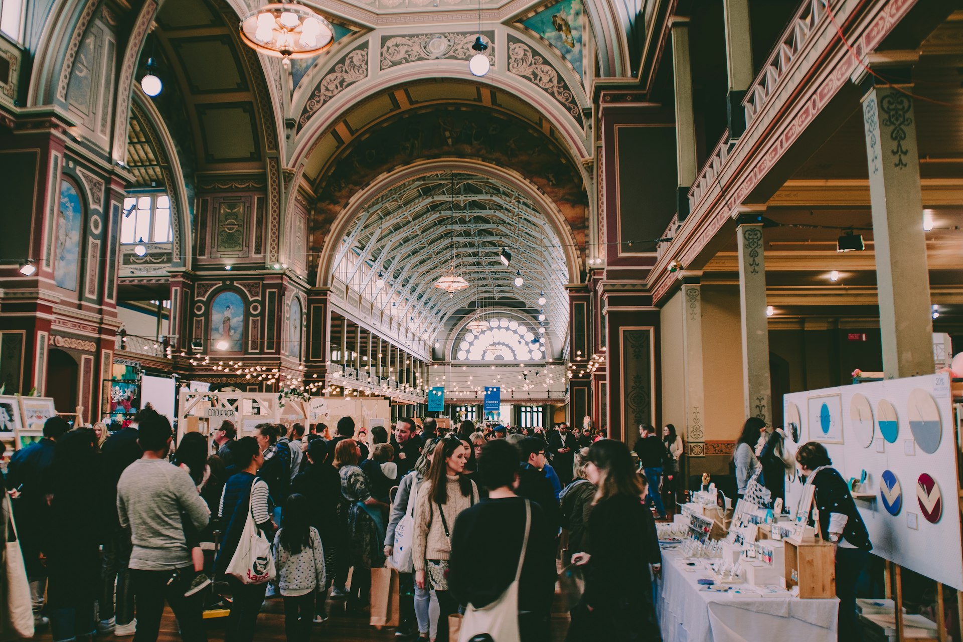 people walking in hallway of a trade expo