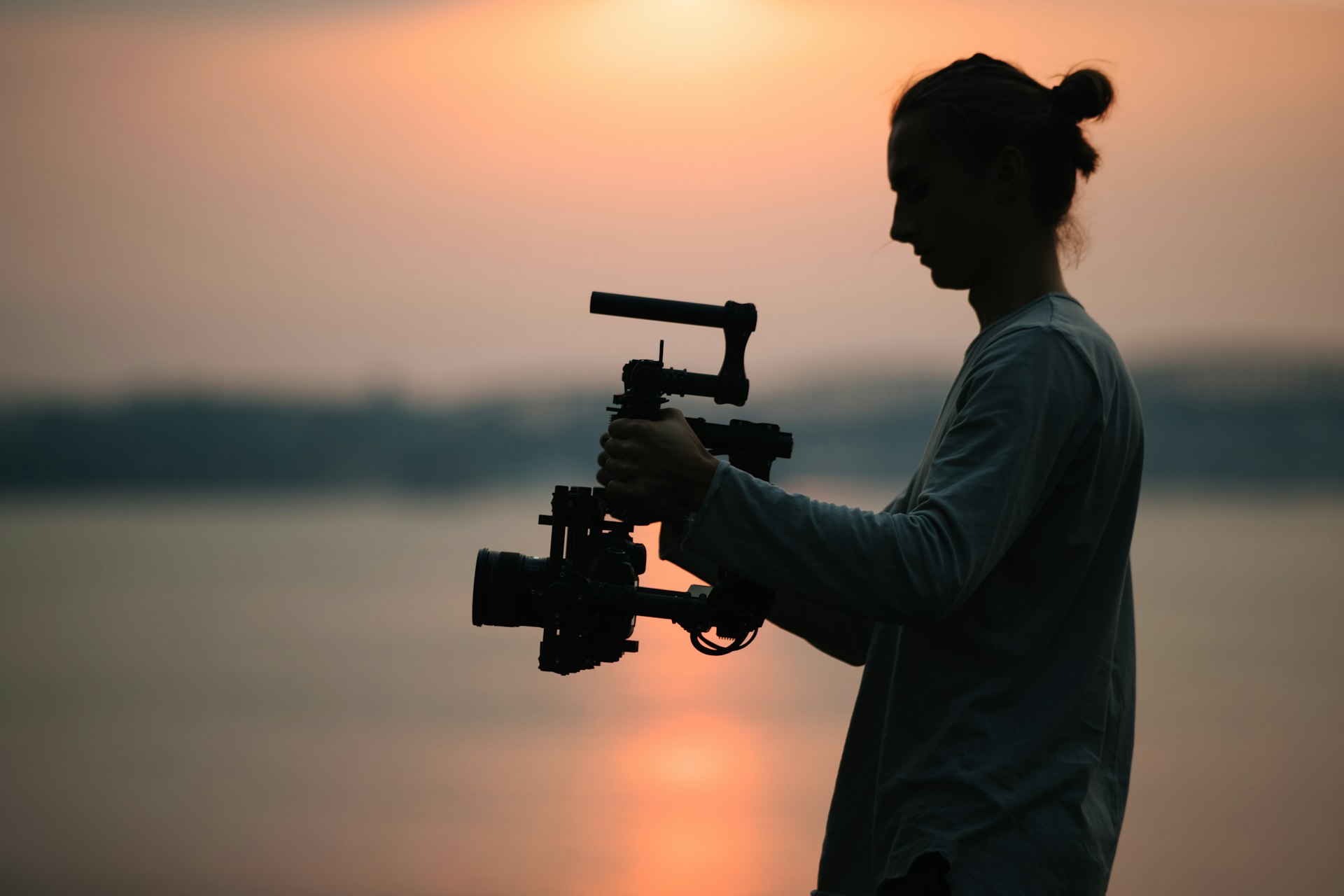Freelance cameraman holding camera